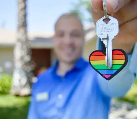 selective photo of gray key with heart key chain