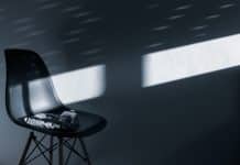black and white high top sneakers on black chair
